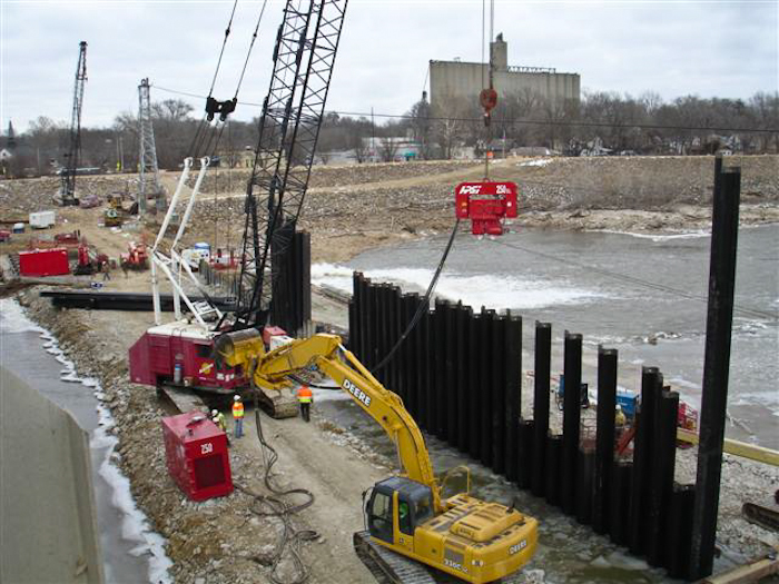 driving sheet piling for dam construction and repair on the Kaw River in Lawrence Kansas