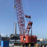 loading drill rig to barge for auger cast pile construction in Galveston, Texas