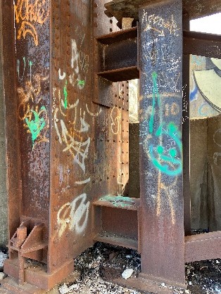 graffiti painted on Rock Island Bridge steel beam structure, in Kansas City Kansas